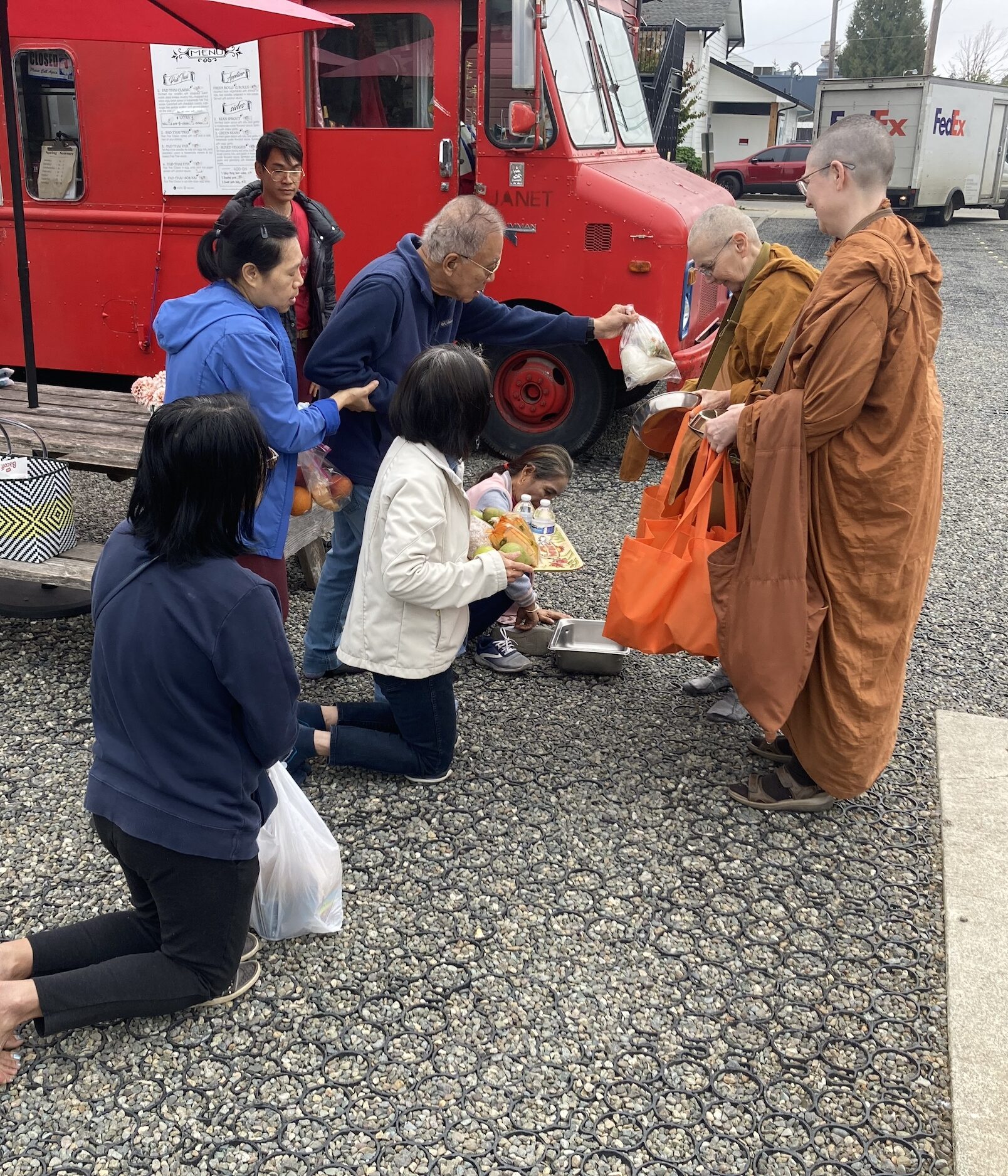 A child offers alms to Ayya